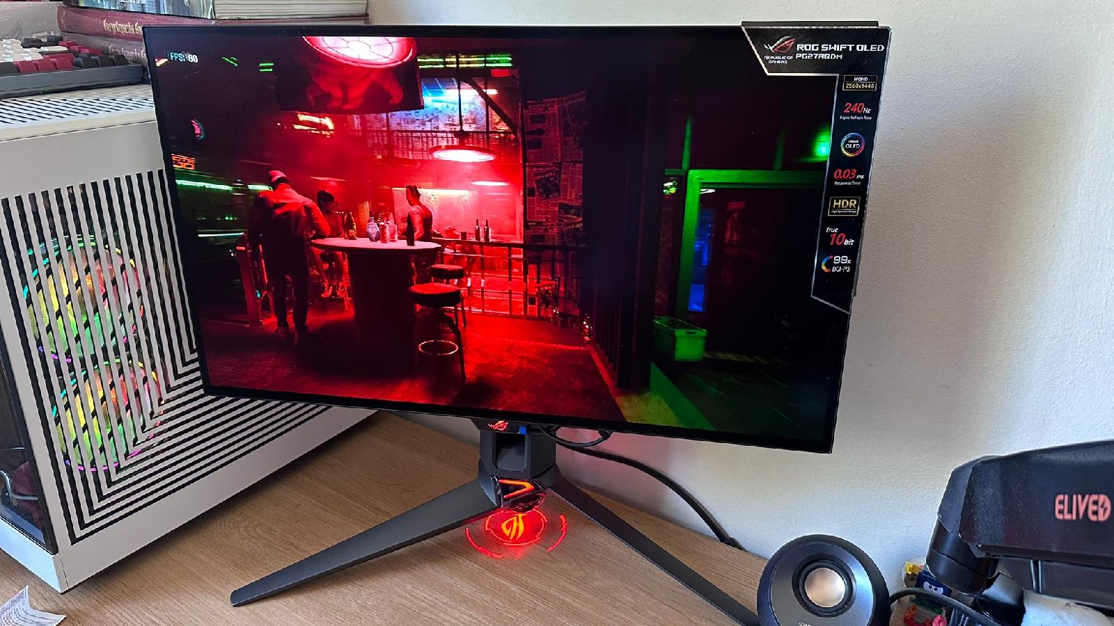 ASUS ROG PG27AQDM playing Cyberpunk in an indoor scene